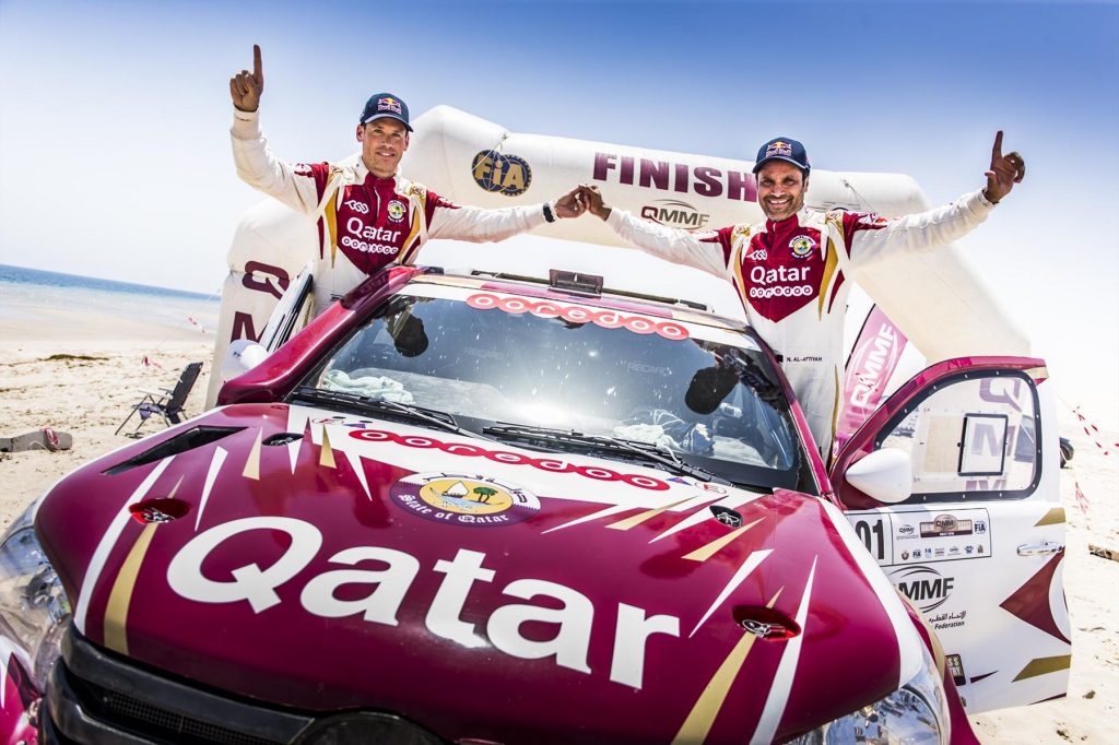 we-are-the-champions-nasser-saleh-al-attiyah-and-matthieu-baumel-celebrate-the-sealine-win_1800x1800